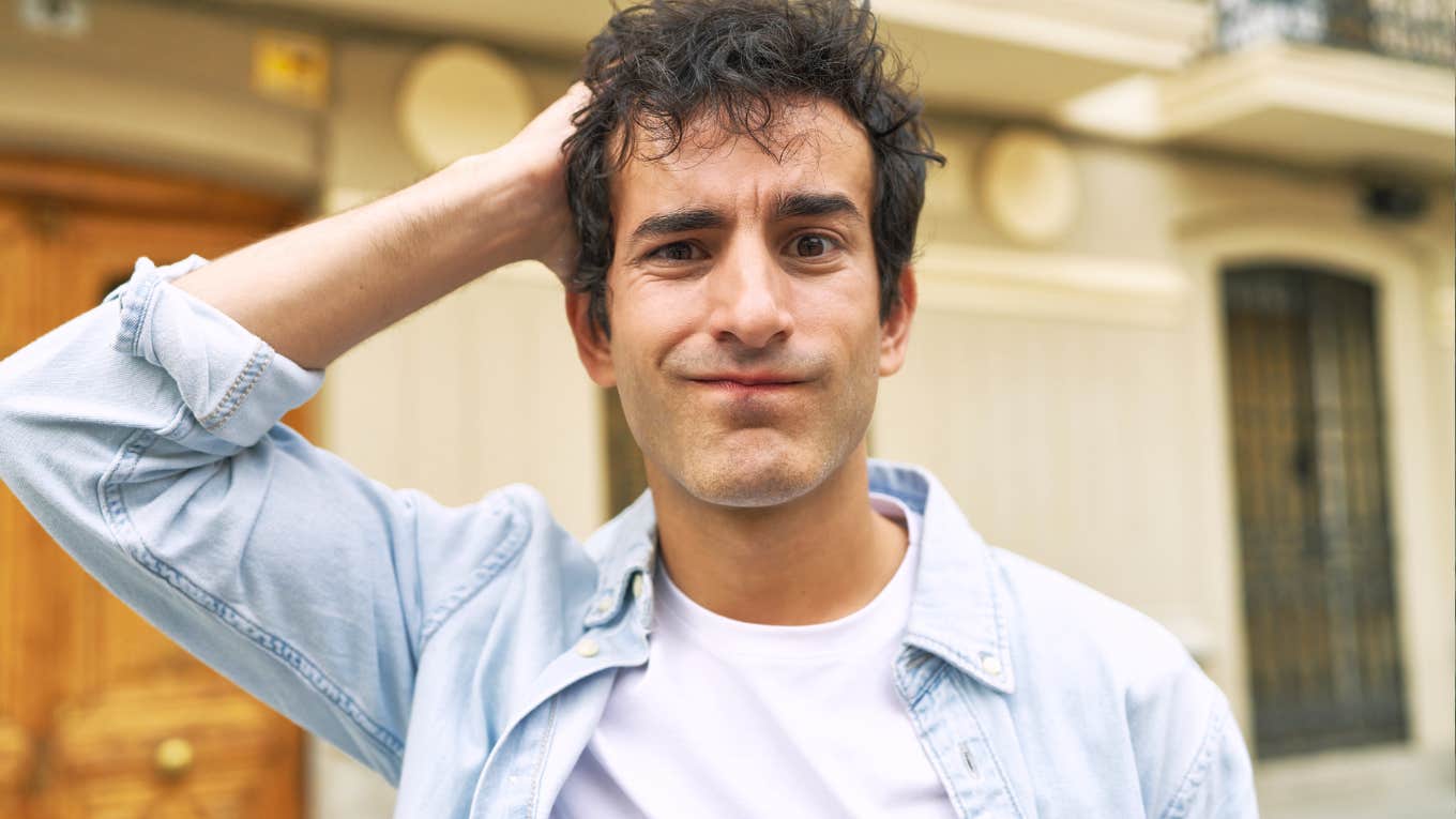 Confused man realizing he’s finally reaching the age men biologically get their act together, illustrating the science behind when maturity actually kicks in