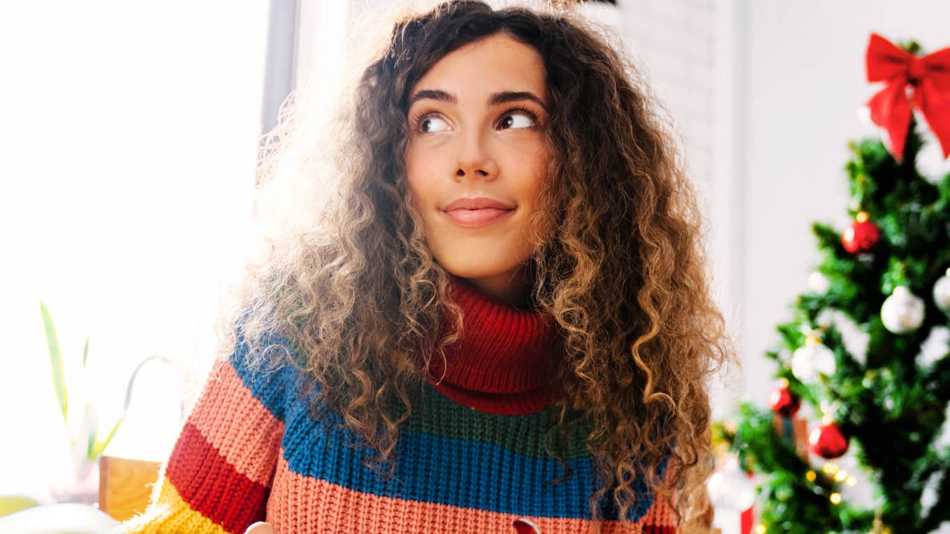 calm unbothered woman using mental tricks to stay centered while surviving the holidays with her toxic family.