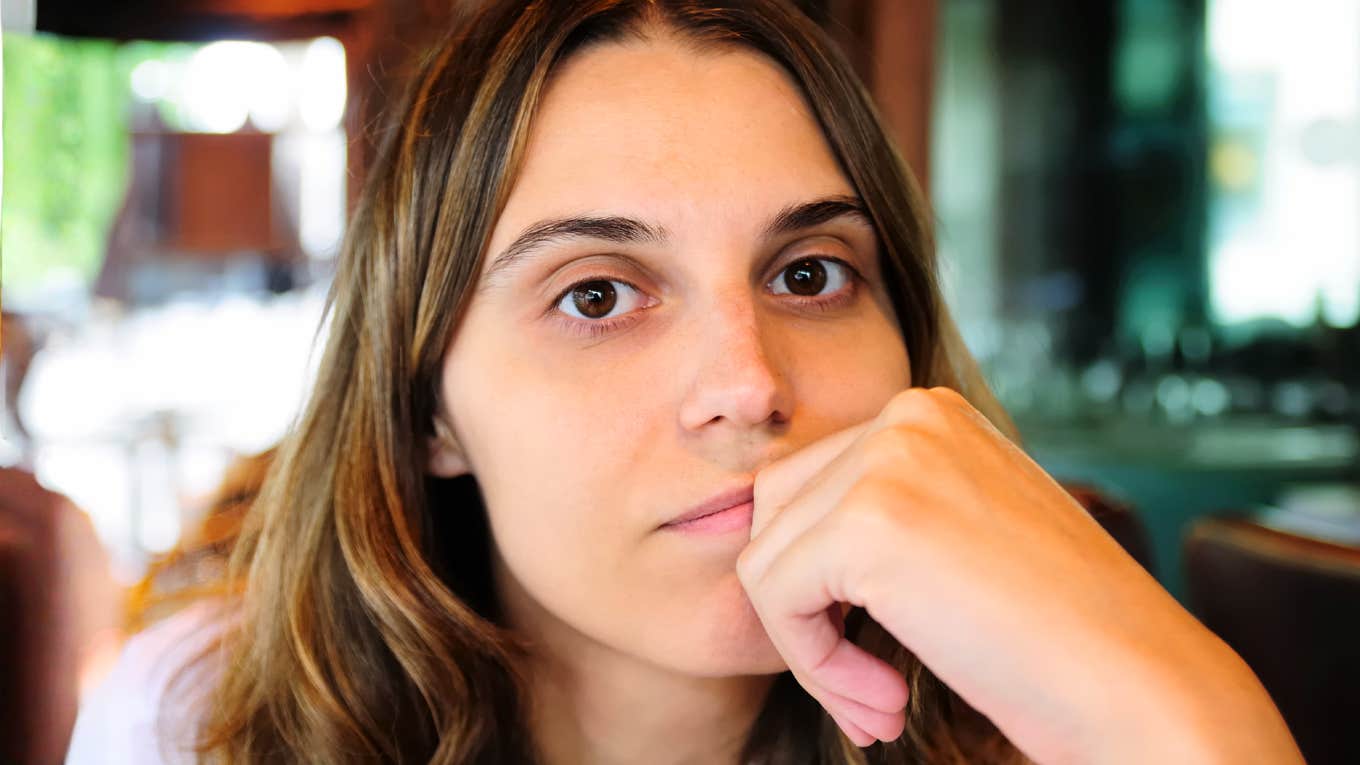 heartbroken person finding calm clarity while repeating gentle healing phrases, illustrating the simple language that helps people get over heartbreak faster