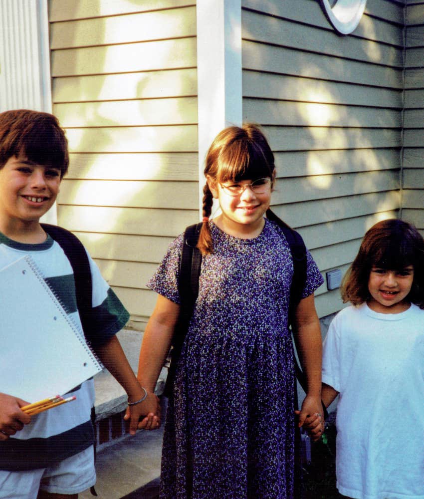 Happy girl holds siblings hands showing life skill of providing