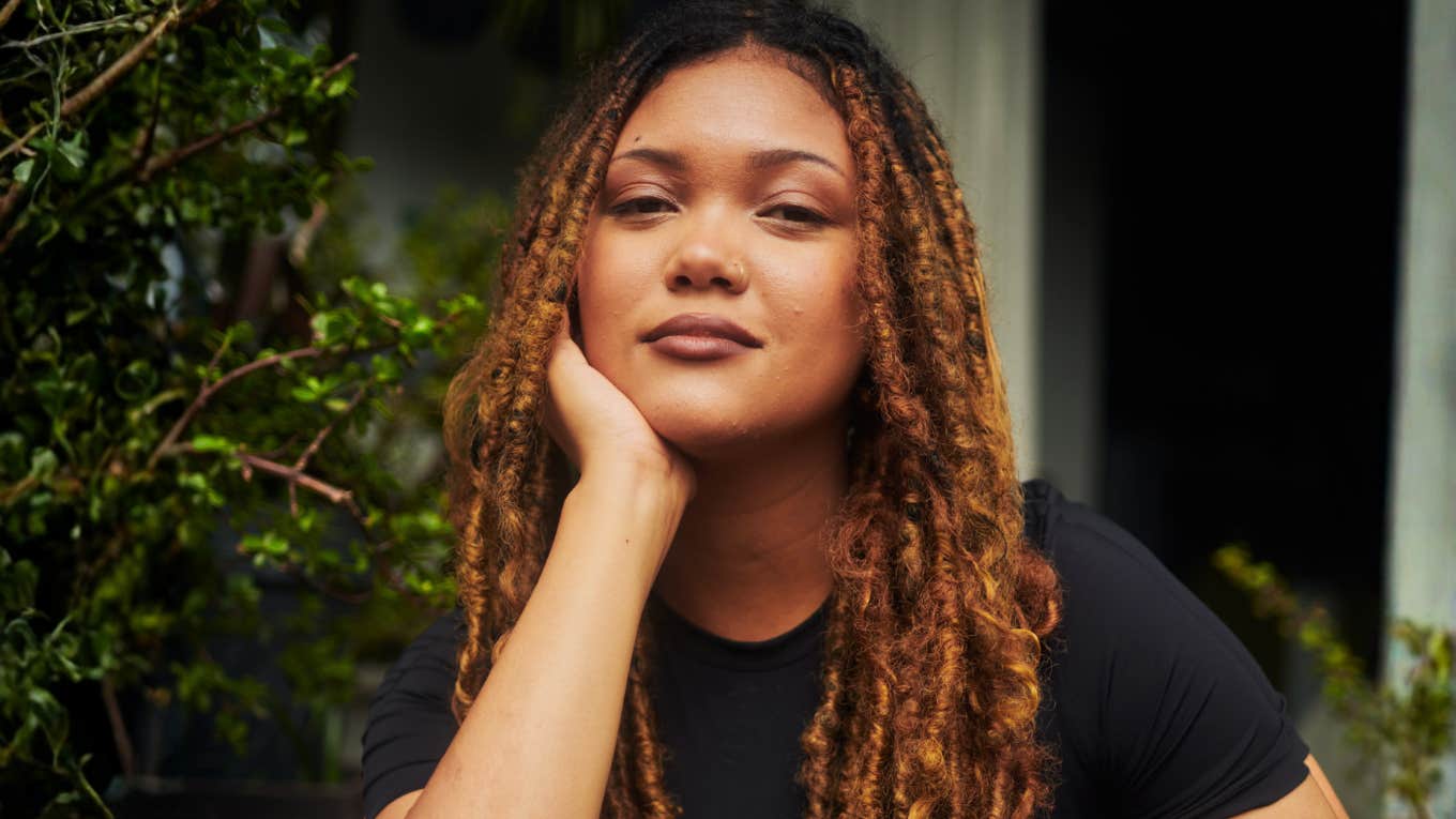 Woman sitting in a quiet reflective moment showing the subtle reasons a marriage might still work before you decide to leave.