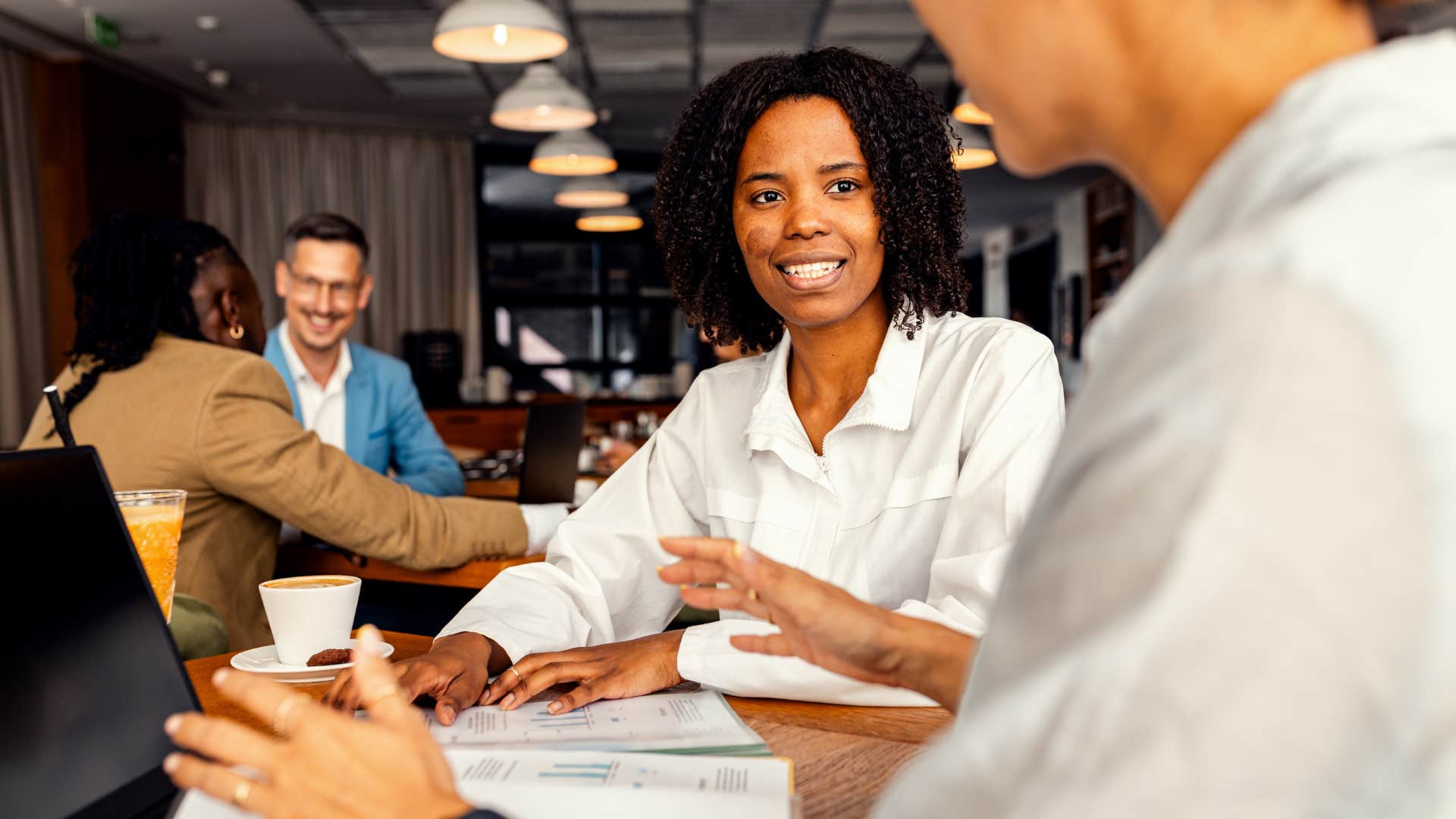 Happy person collaborates at work showing habit of visionaries