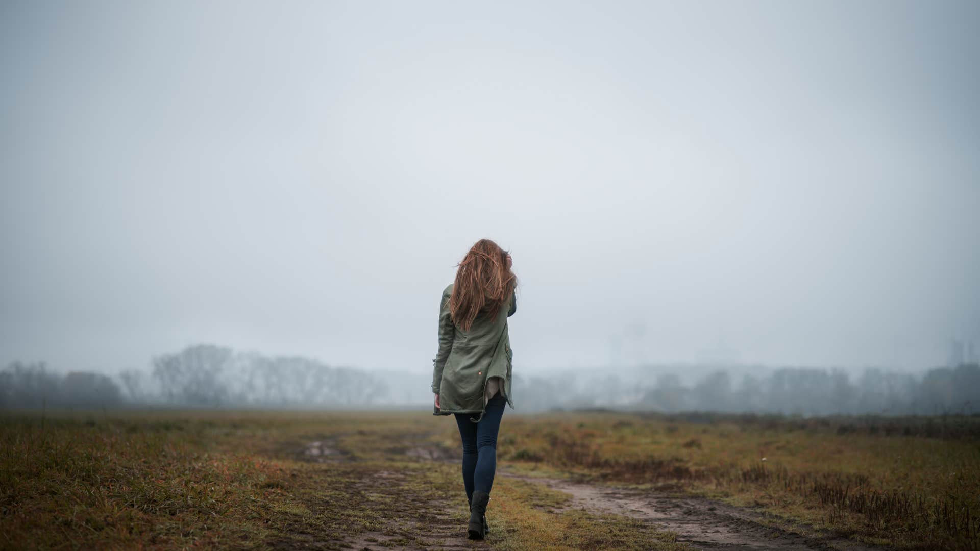 Confident person walks into fresh fog and trees showing habit of visionaries