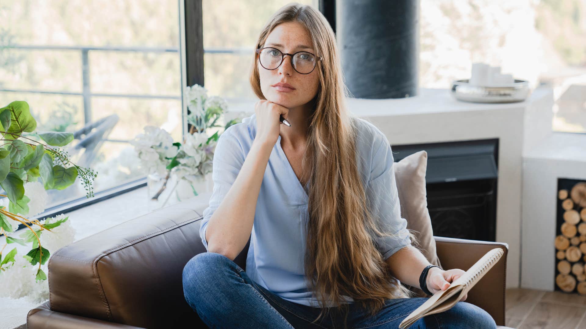Relaxed person clarifies thoughts in notebook showing way to be happy 