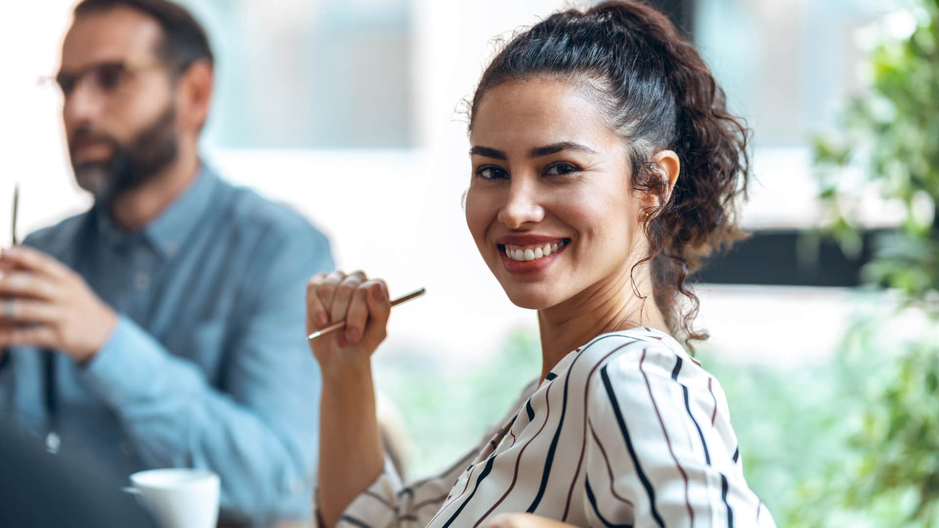 Pleased person in business meeting showing way to be successfully happy