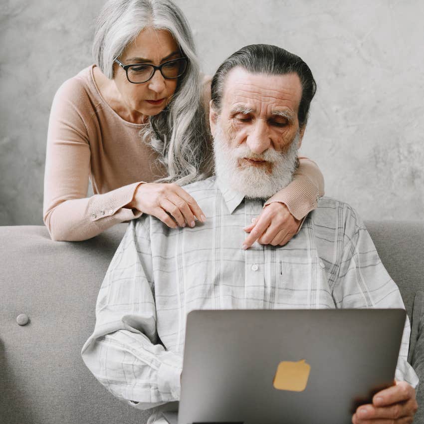 elderly man watching AI content on laptop