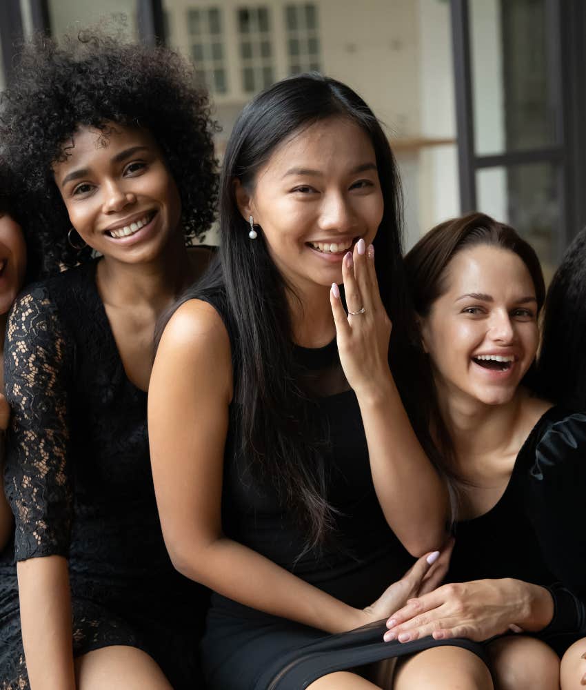 Excited woman with small bridal party shwoing big fun day