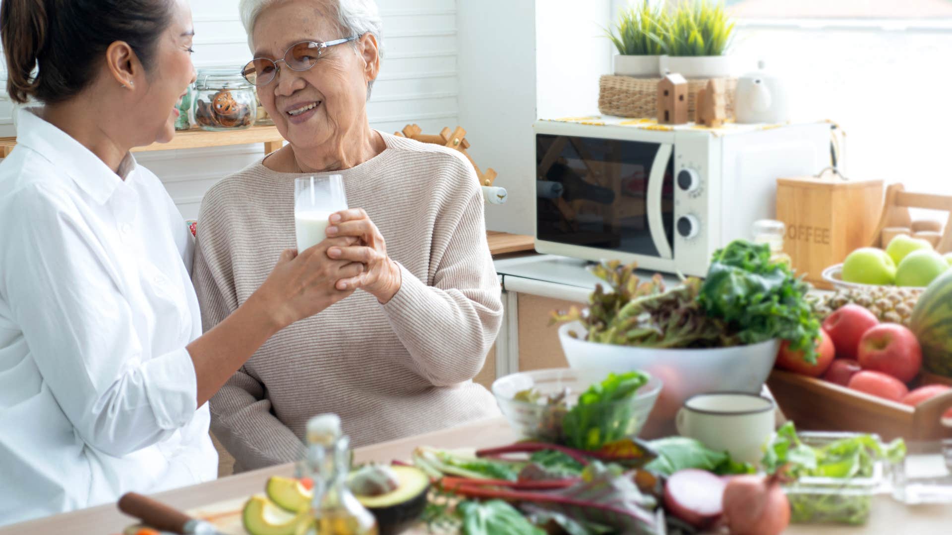 older mom eating with daughter on food they grew
