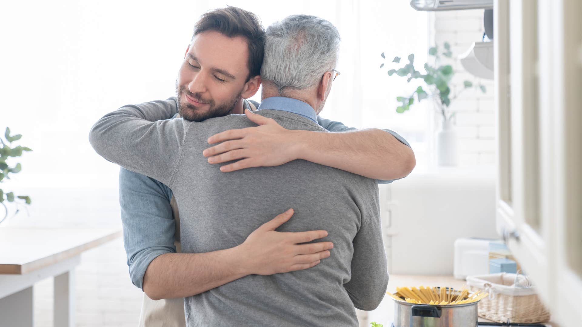 man hugging his boomer dad