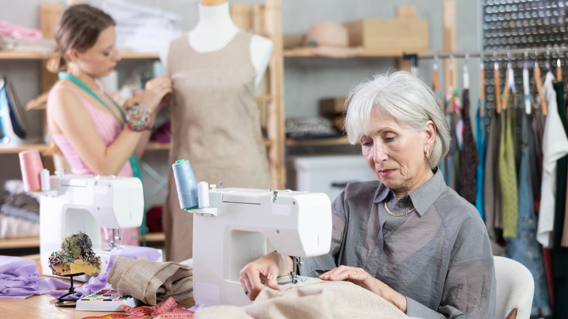 boomer woman sewing clothes to wear