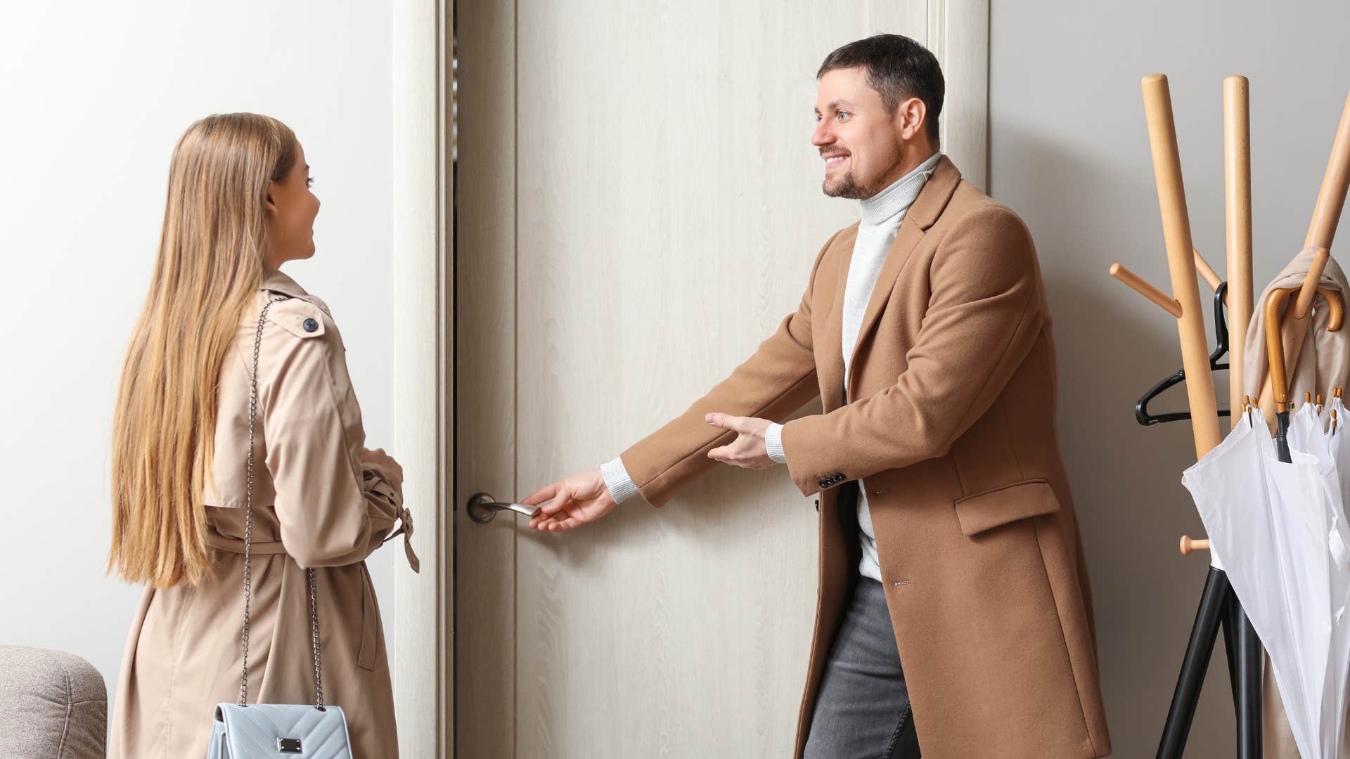 man with good manners opening door for woman