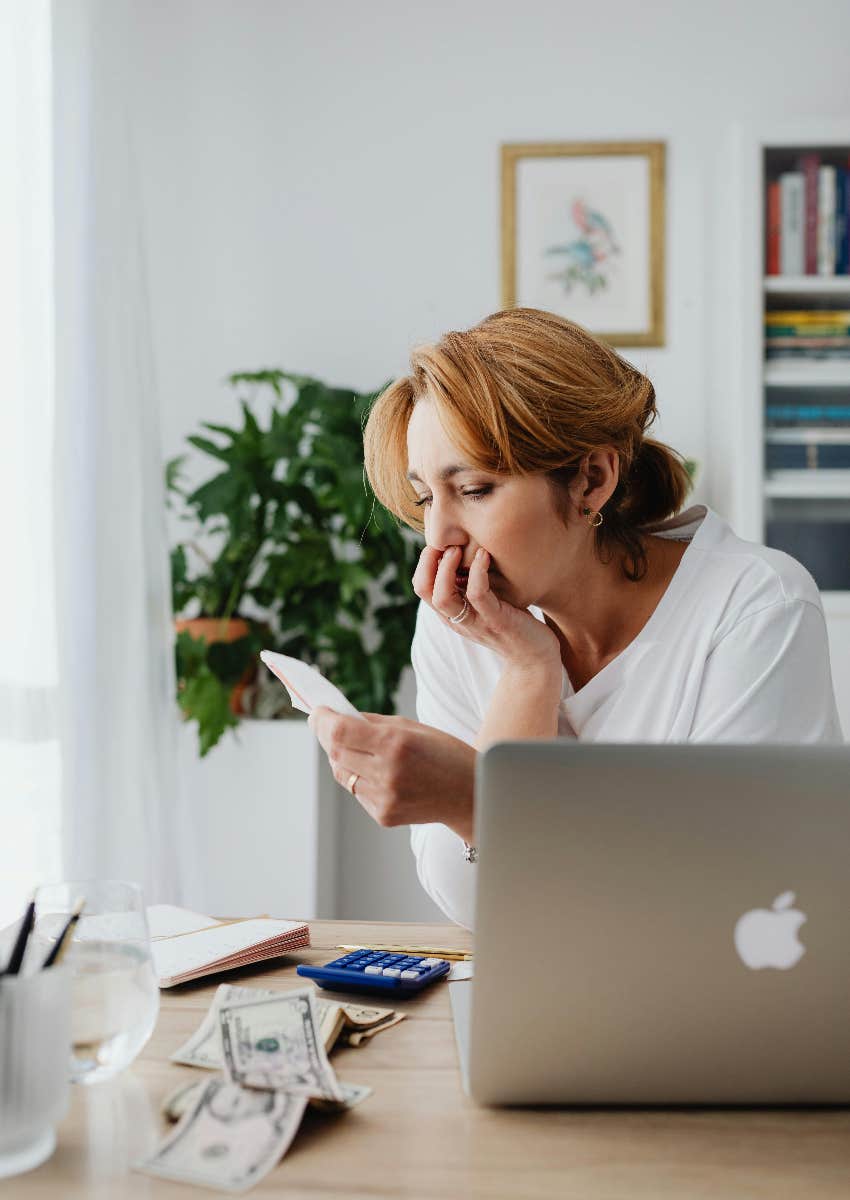 stressed woman paying bills