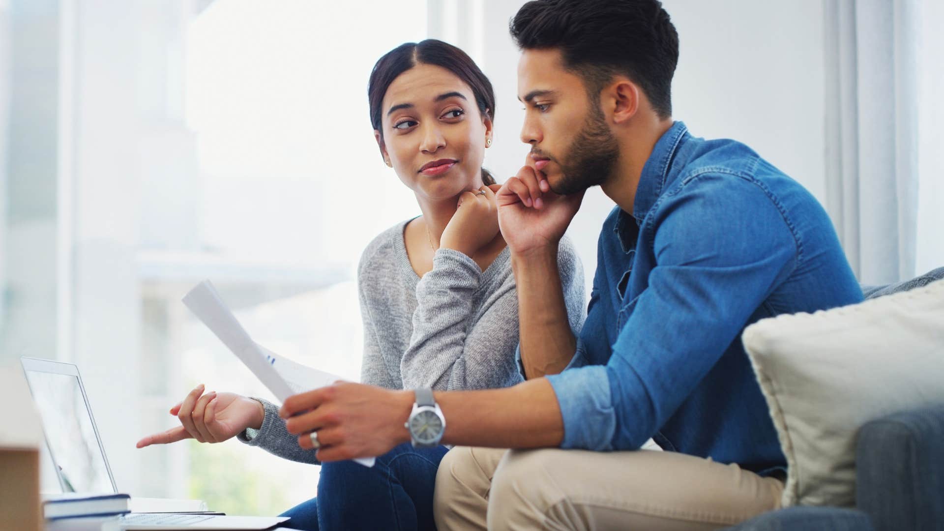 woman sitting with partner going over finances