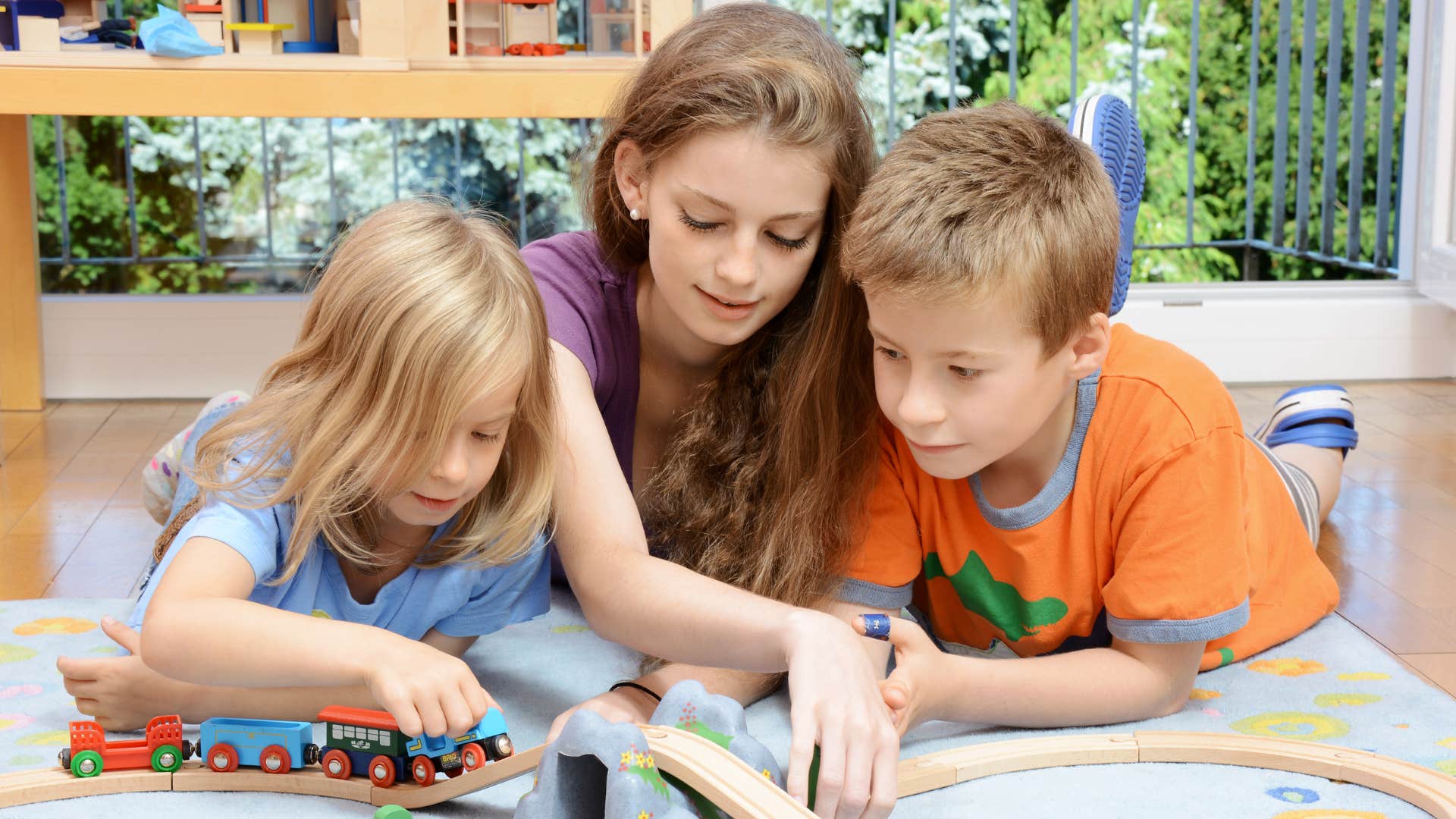 siblings sharing during playtime
