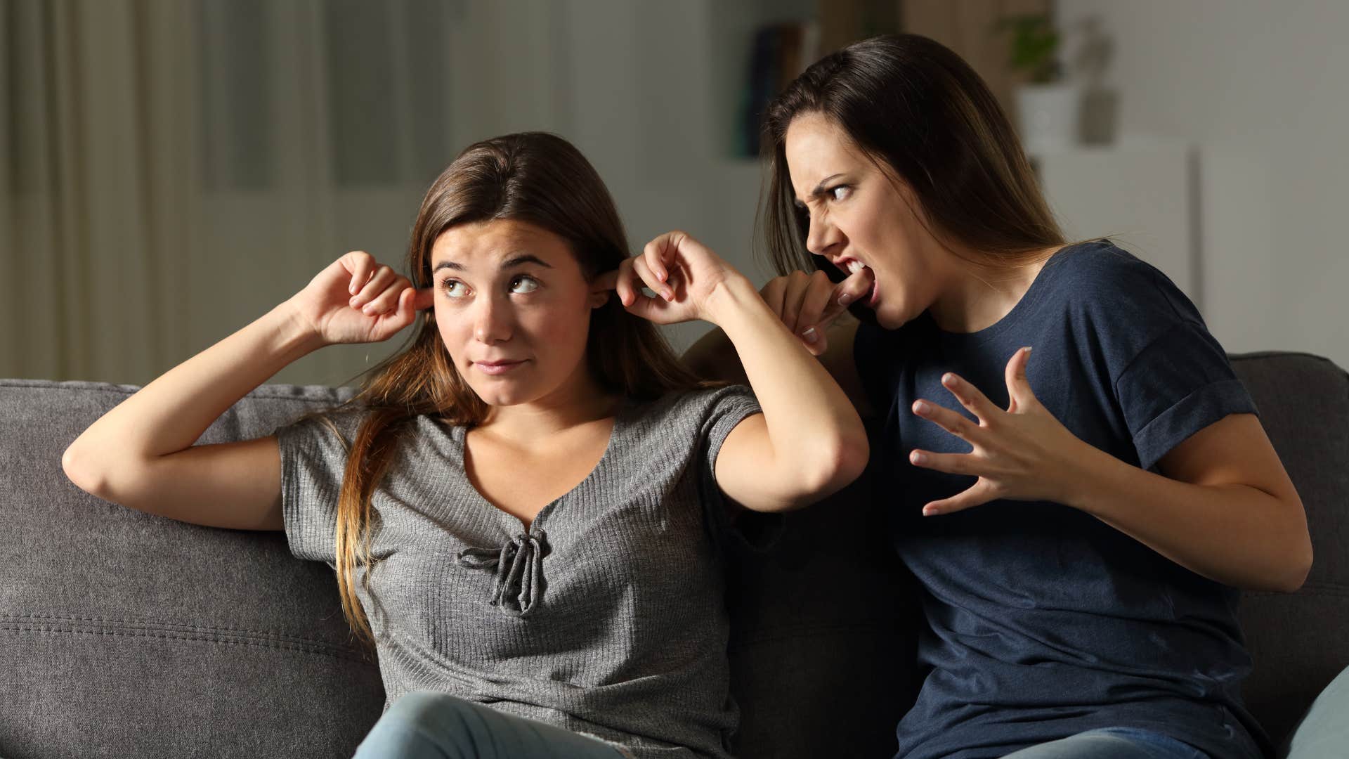 adult sisters fighting and teasing each other