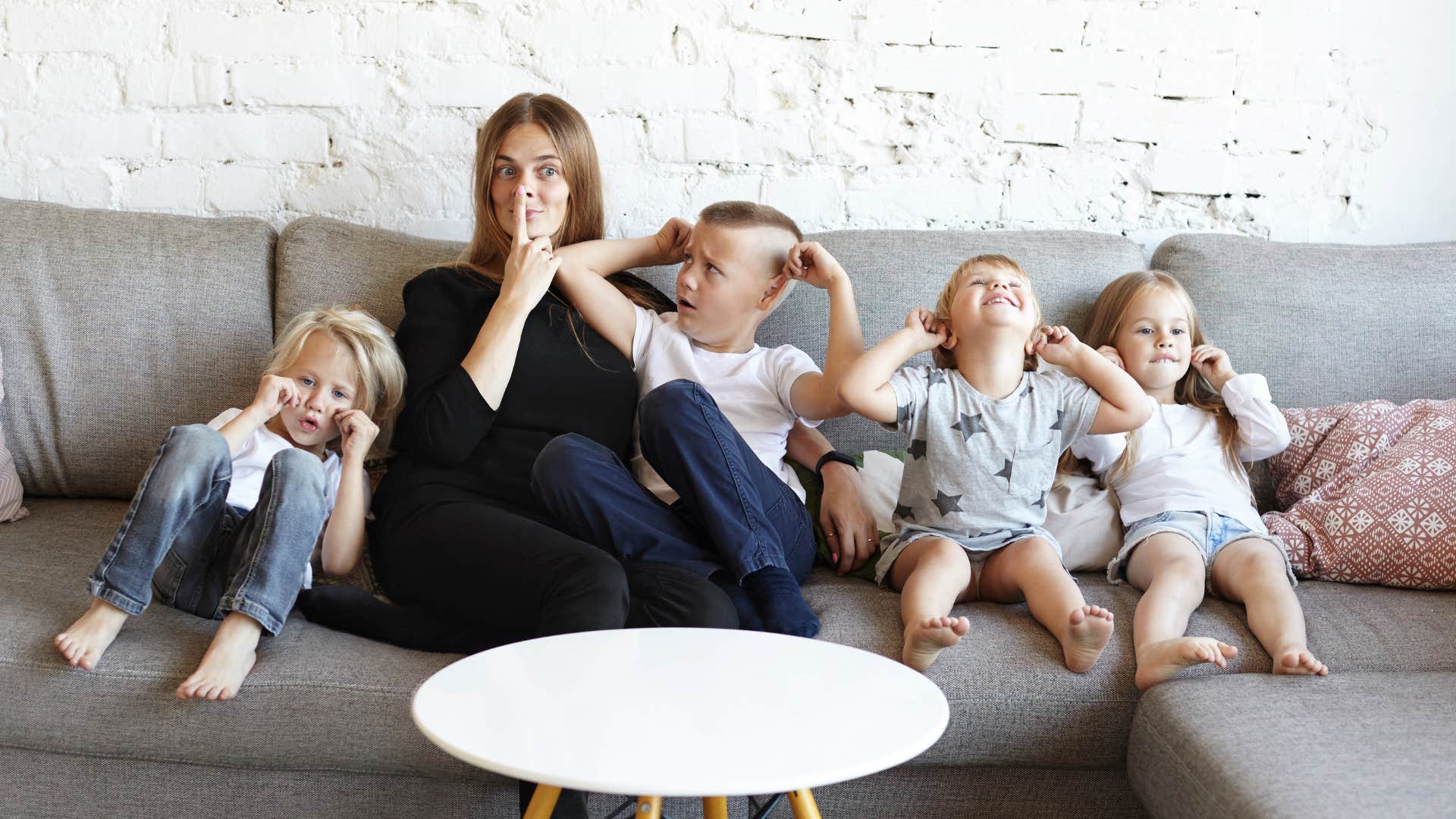 woman who was an only child sitting with her large family