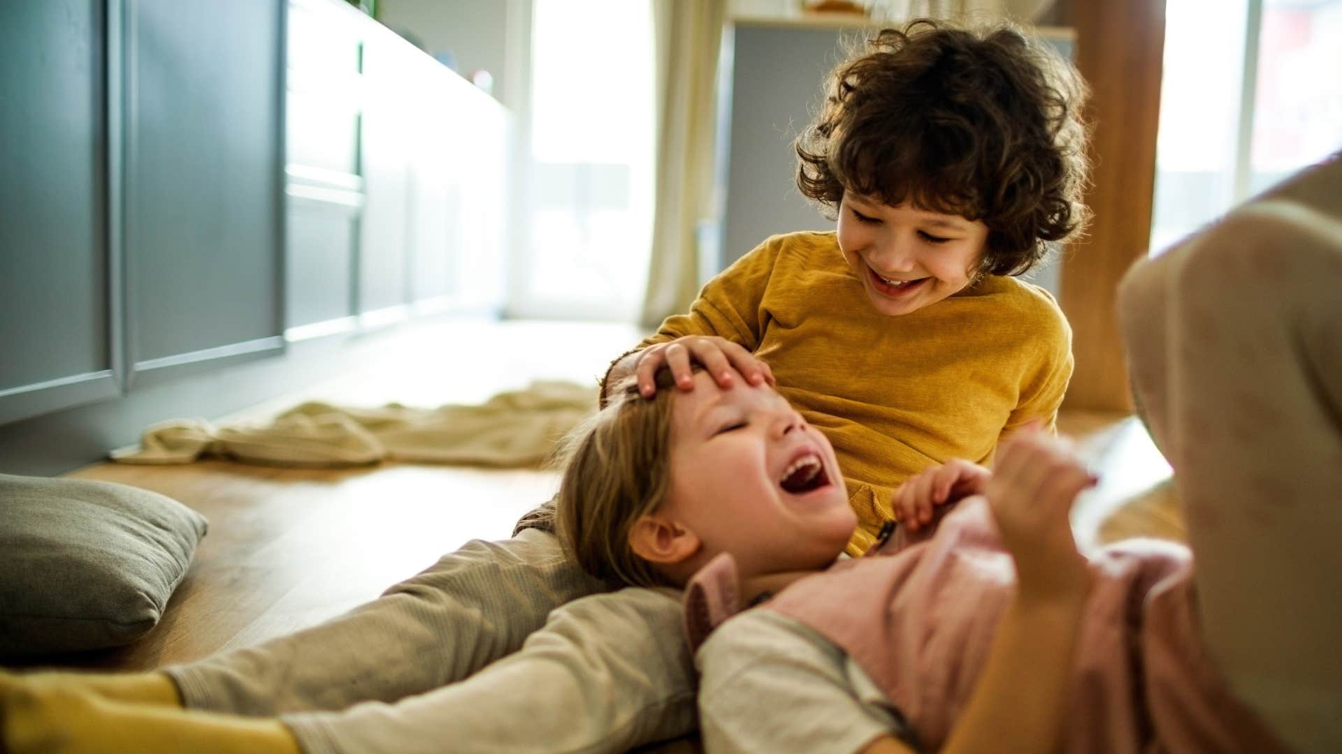 siblings playing teaching each other social skills