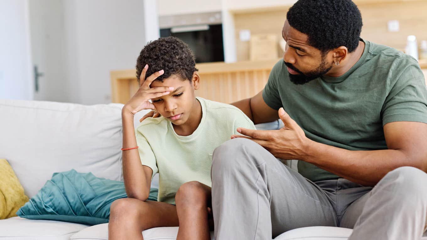 dad having serious conversation with his teen son