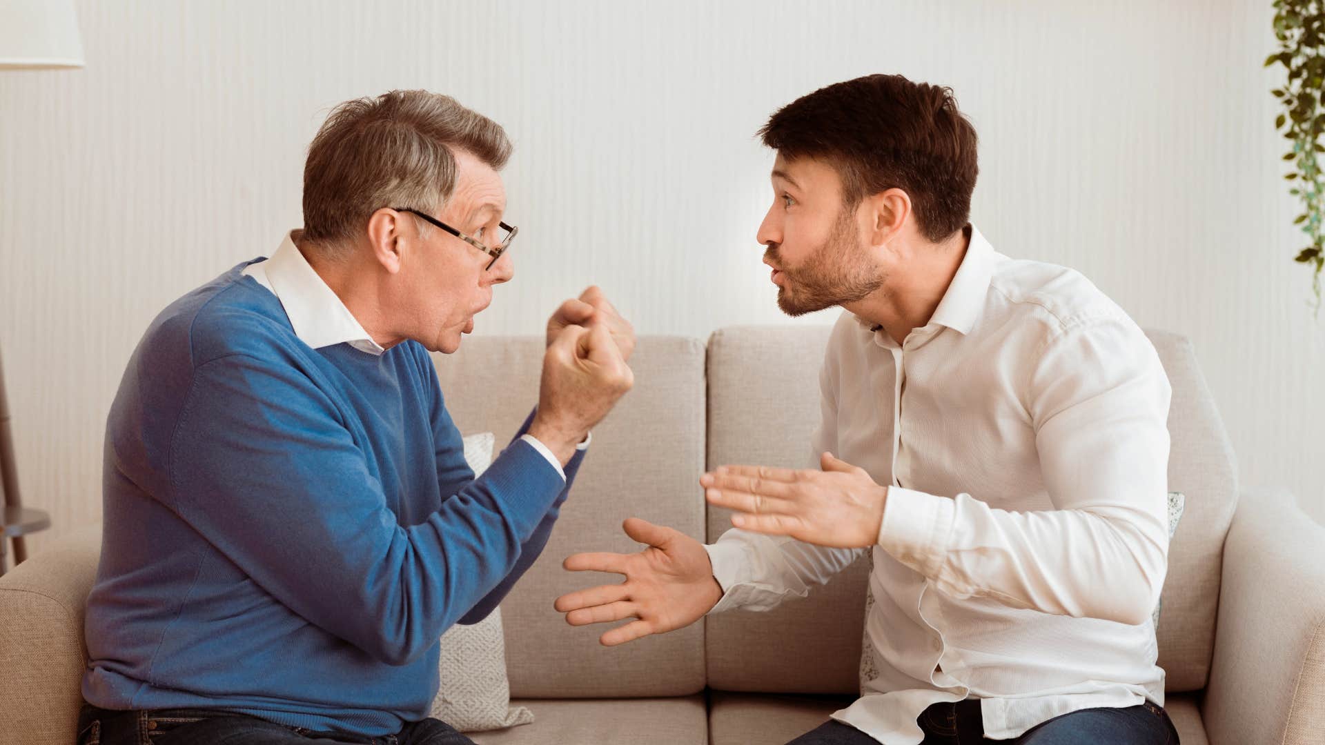 man yelling at his son telling him to stop talking back
