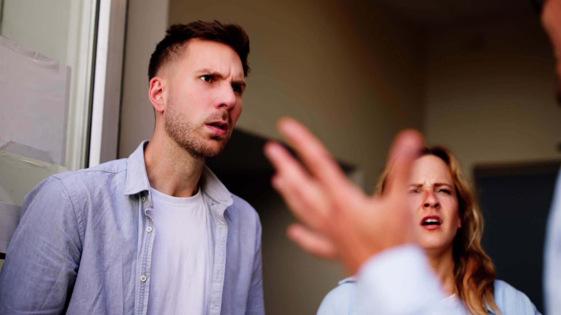 Man interrupting people at home.