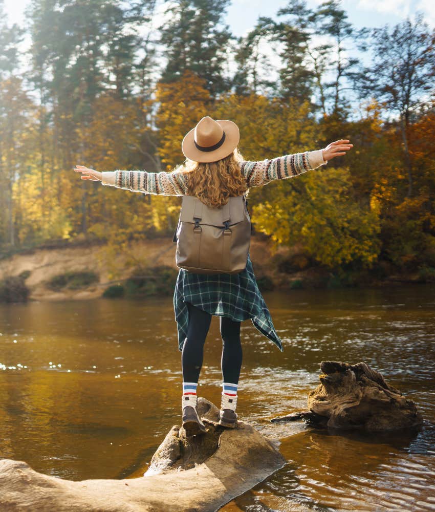 Carefree person in nature breathes fresh air showing simplicity