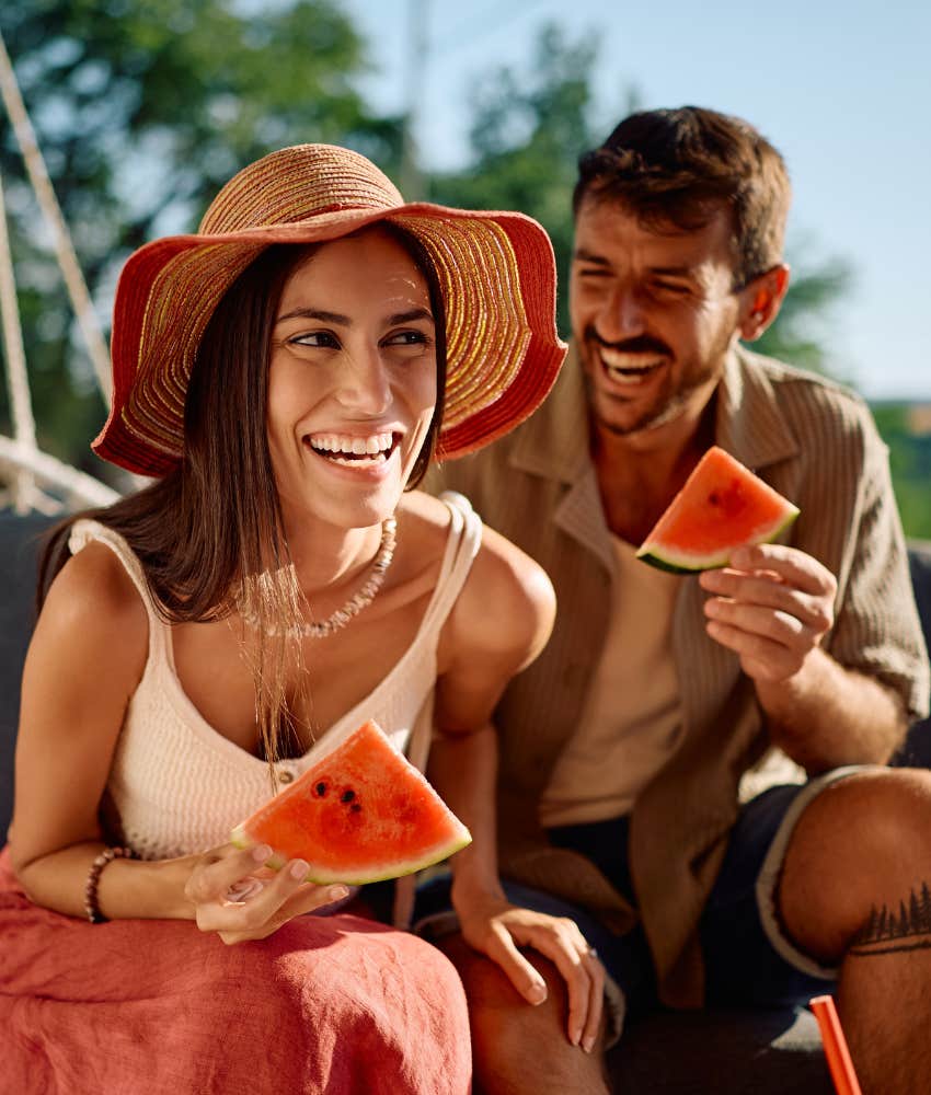 Cheerful couple know eat fruit showing they know what's up about simplicity