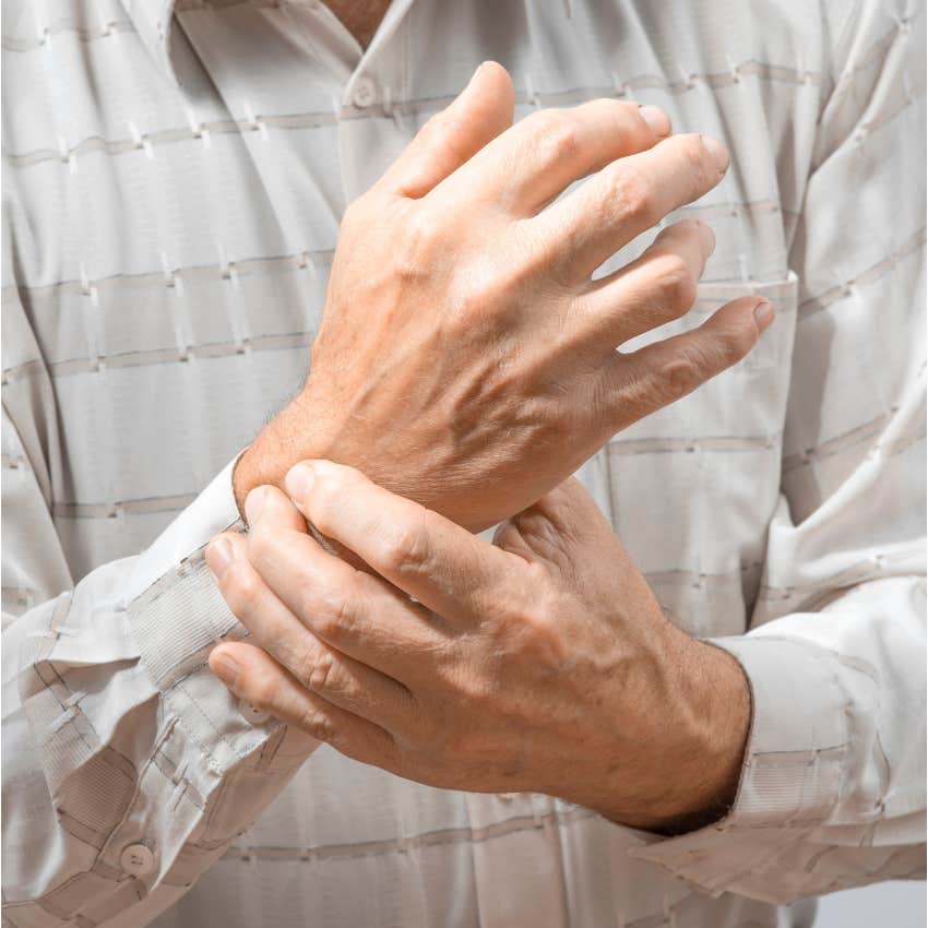 man pressing webbing of hand to catch his breath before life gets harder