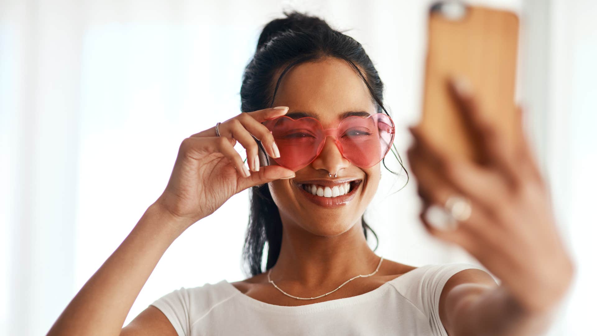 influencer curating an image taking selfie