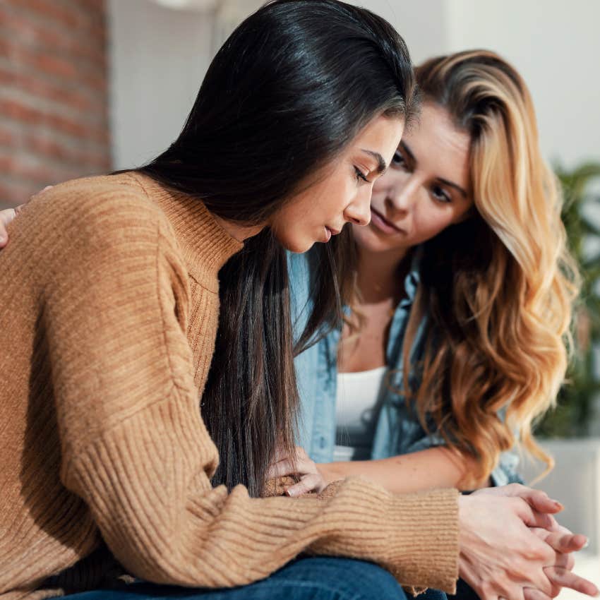 woman who needs to stop loving someone as she asks her friend for her opinion