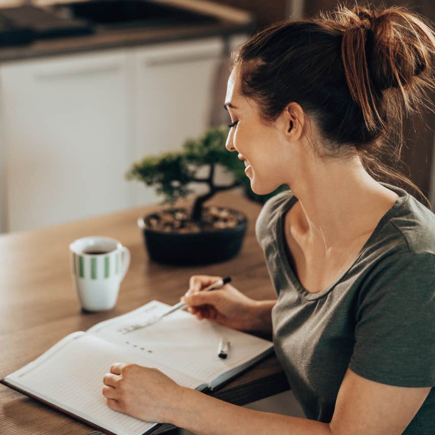 woman who knows in her heart she has to stop loving someone by making a list of their annoying traits