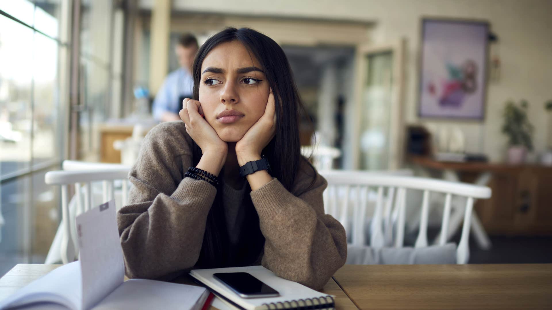 stressed woman sitting with a planner