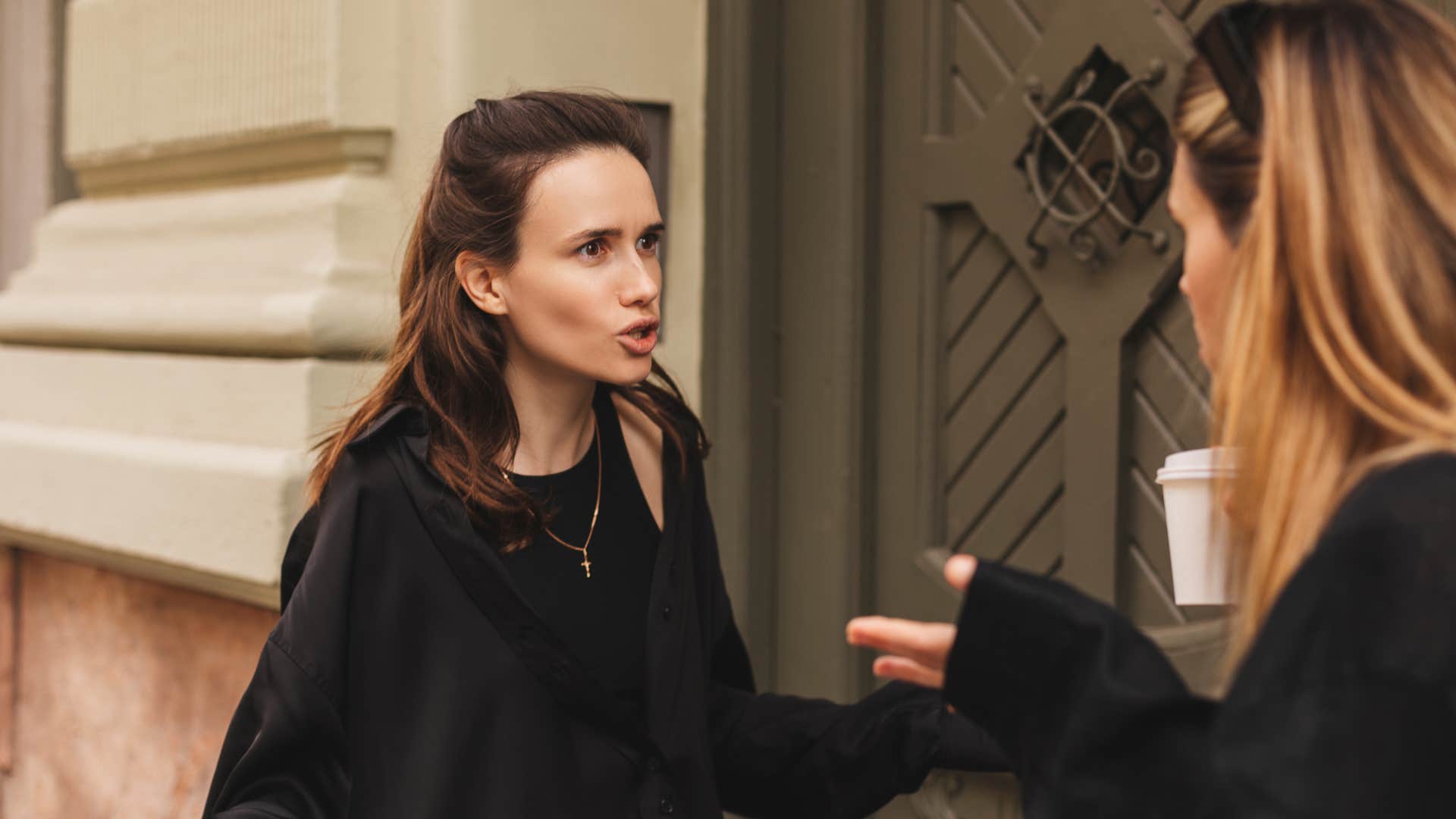 woman yelling at friend perceiving disagreements as a personal attack