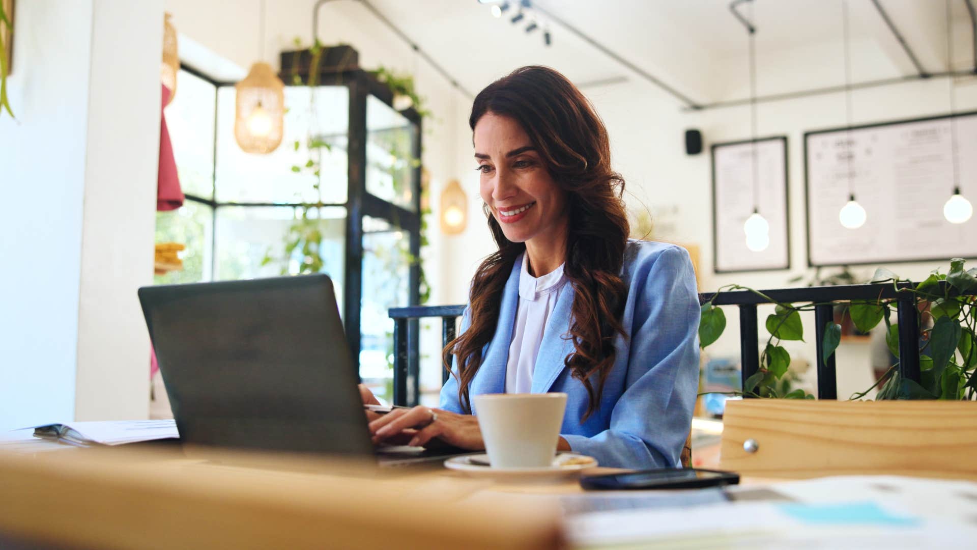 woman writing on laptop with autocorrect or spellcheck