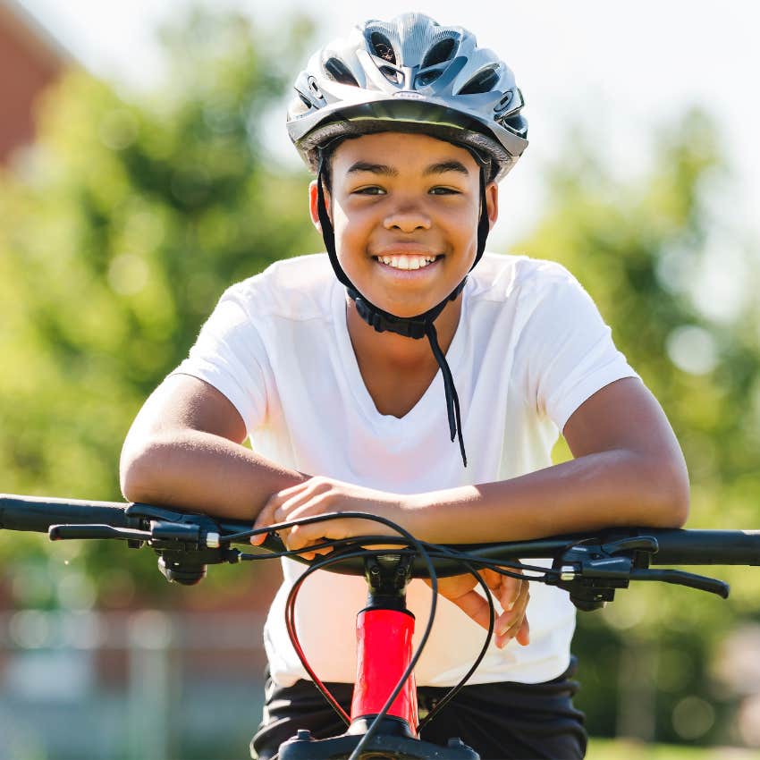 KIds managing their own free time while riding on a bike. 