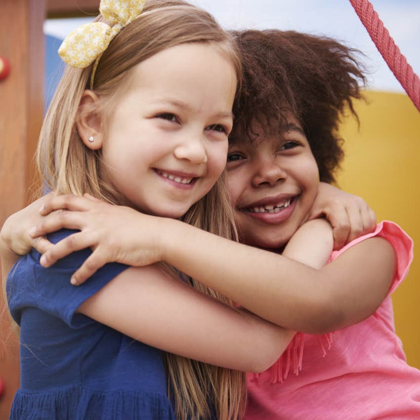 Little girls hugging and navigating boredom.