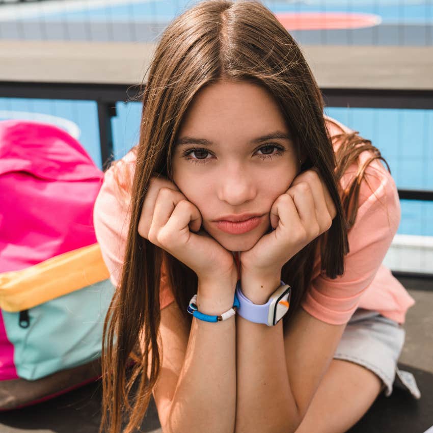 Little girl sitting with disappointment at school