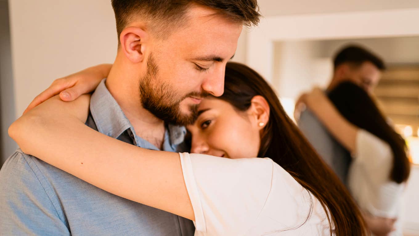 Warm extroverted partner gently hugging a quiet introvert showing the things extroverts who love introverts naturally understand about them.