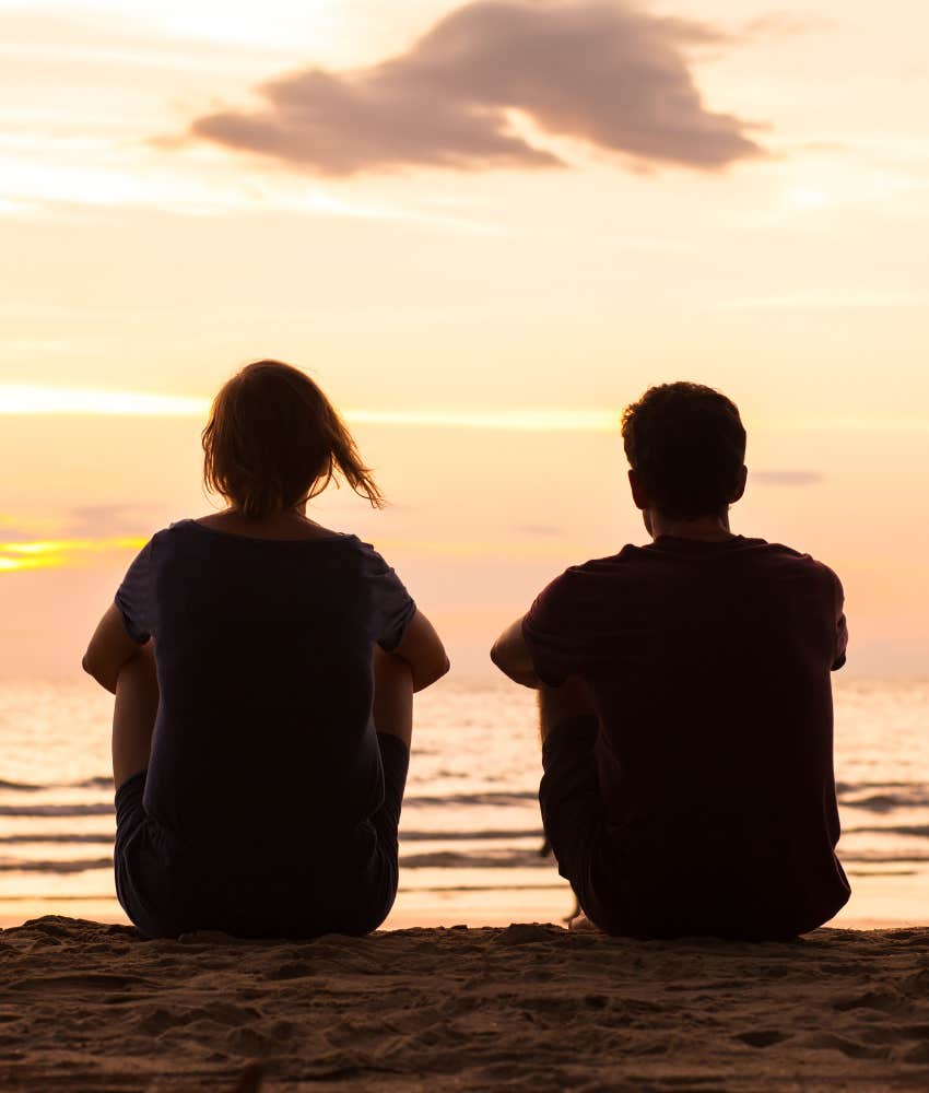 Relaxed couple on beach showing low-key introverted date