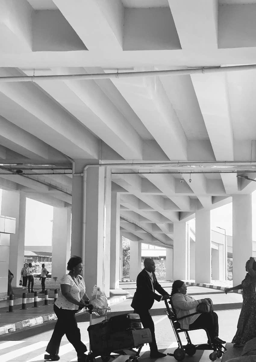 plane passenger in wheelchair in airport