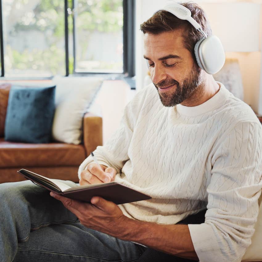 Man who's writing everything down at home