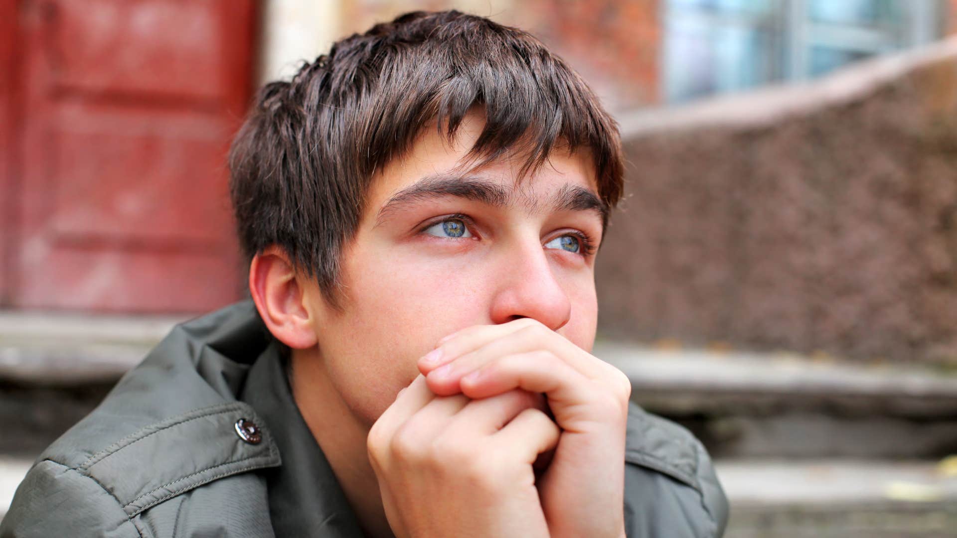 pensive teenage boy accepting that life isn't fair