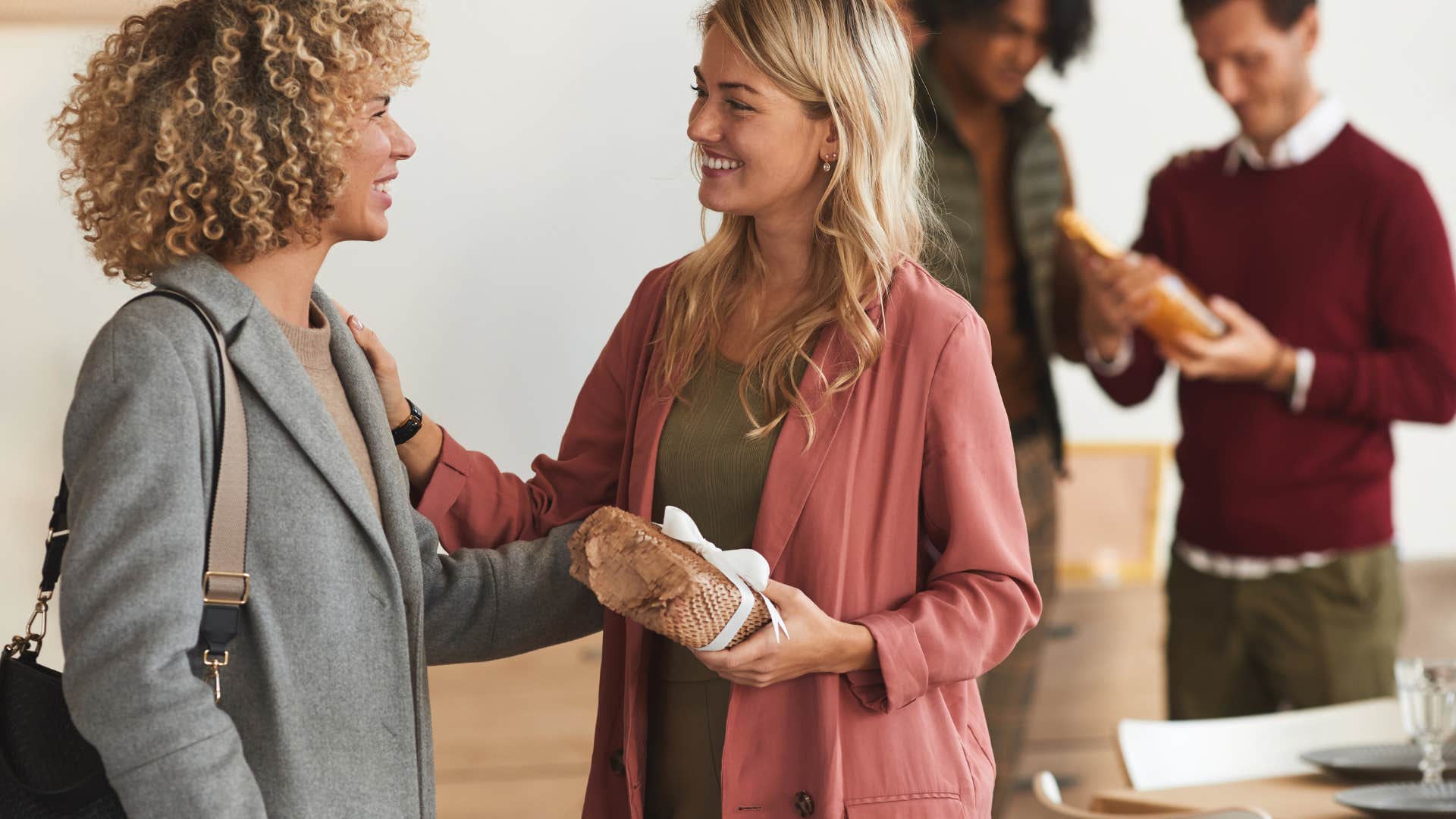 woman giving host gift