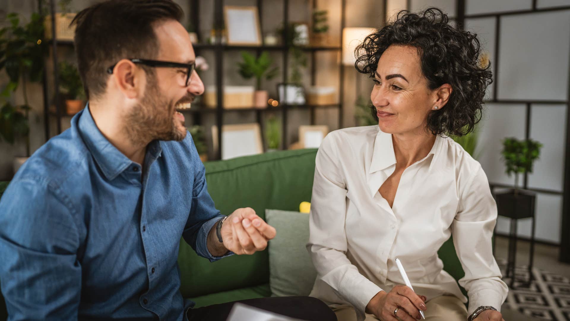 two colleagues having conversation at office without distractions