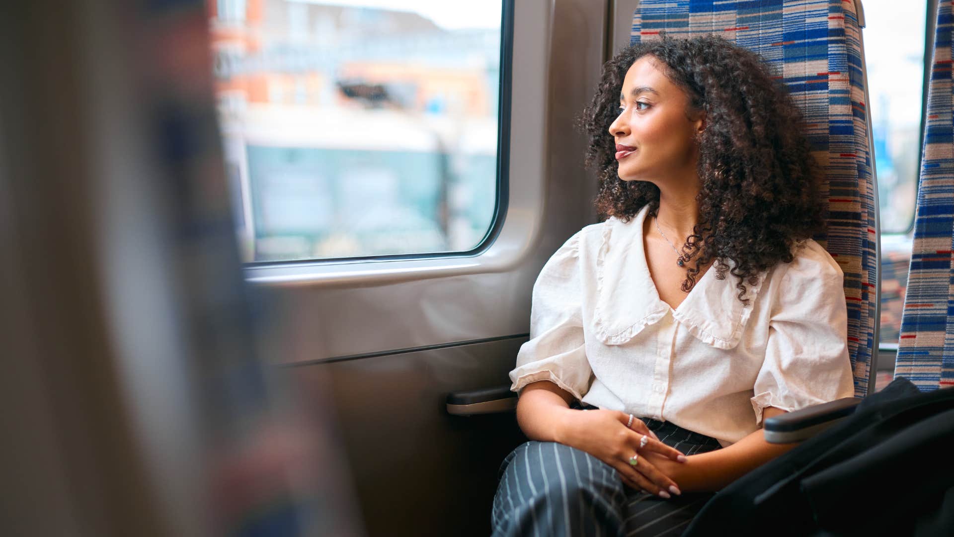 woman sitting on train