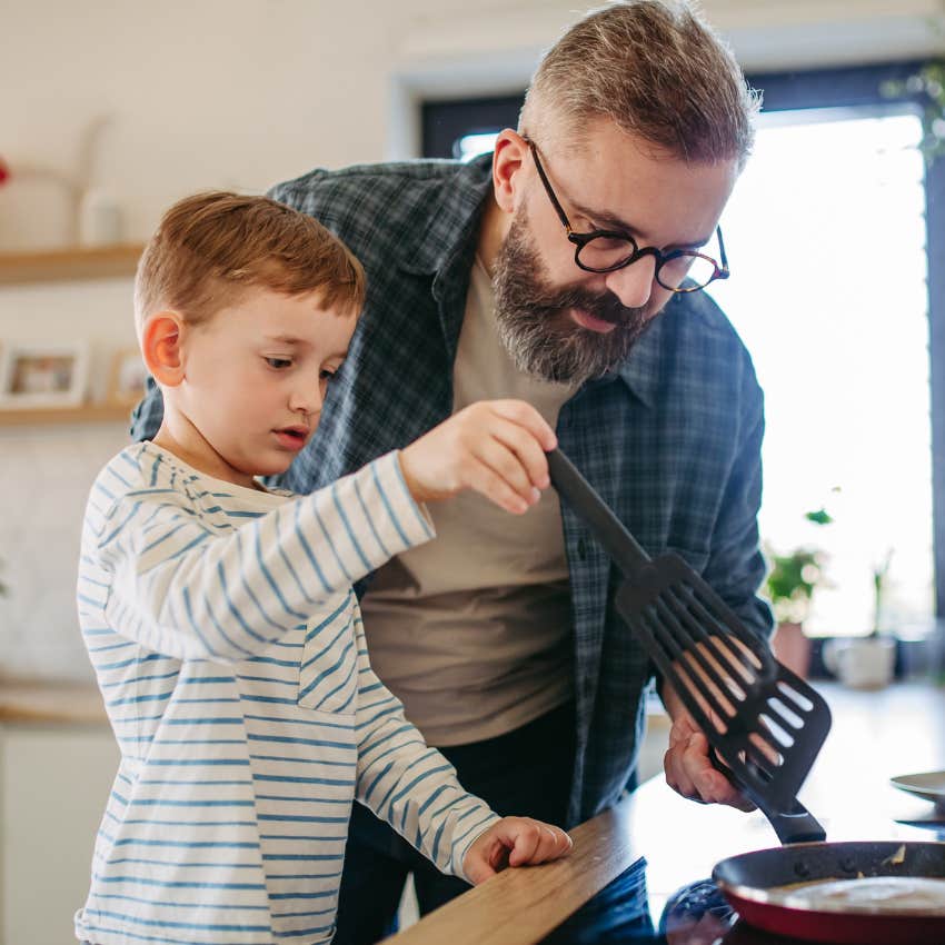 father cooking at home with his son