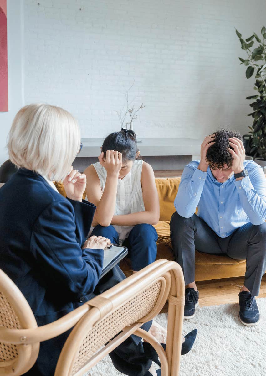 frustrated couple listening to relationship advice from older woman