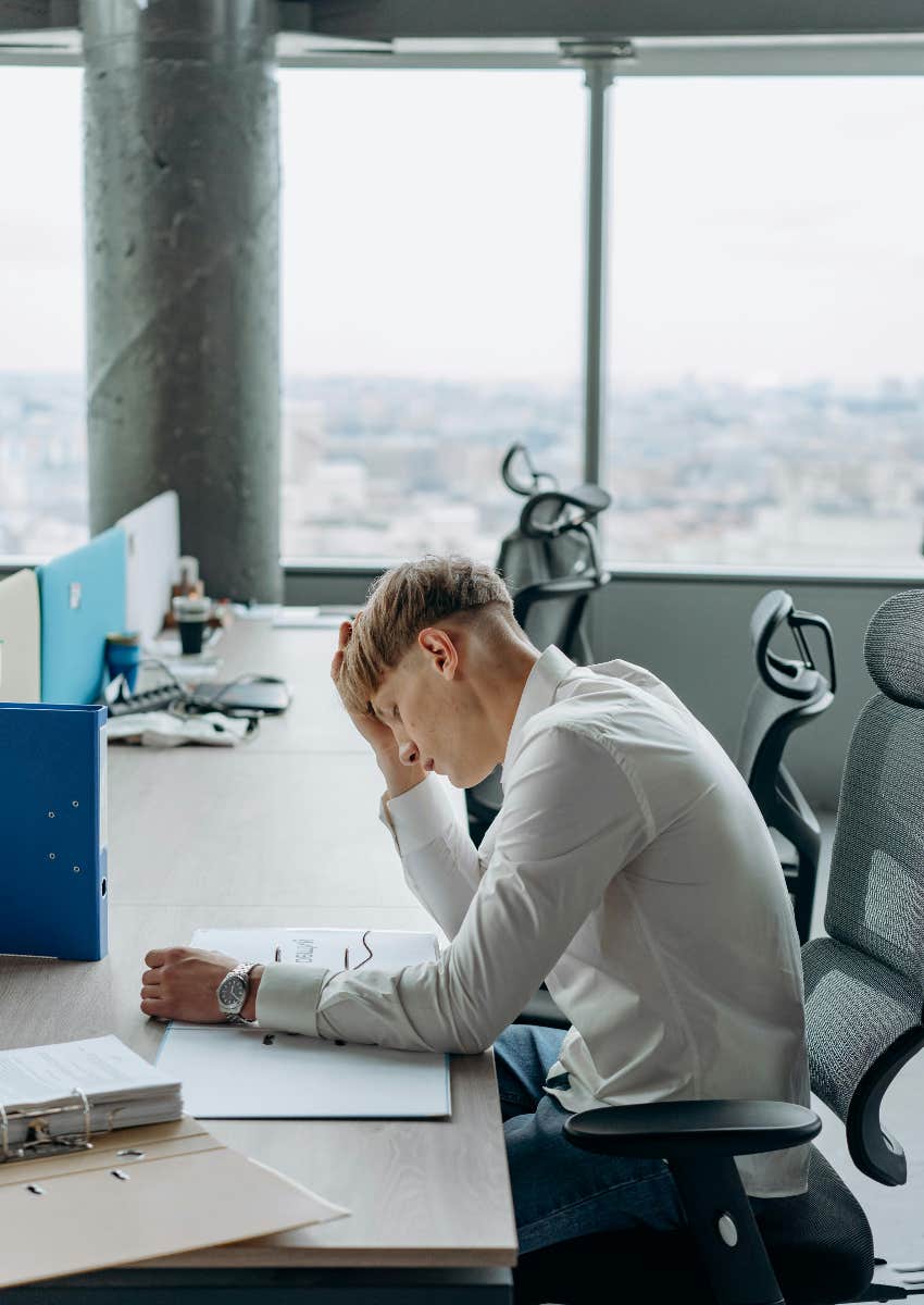 man who is fatigued at work