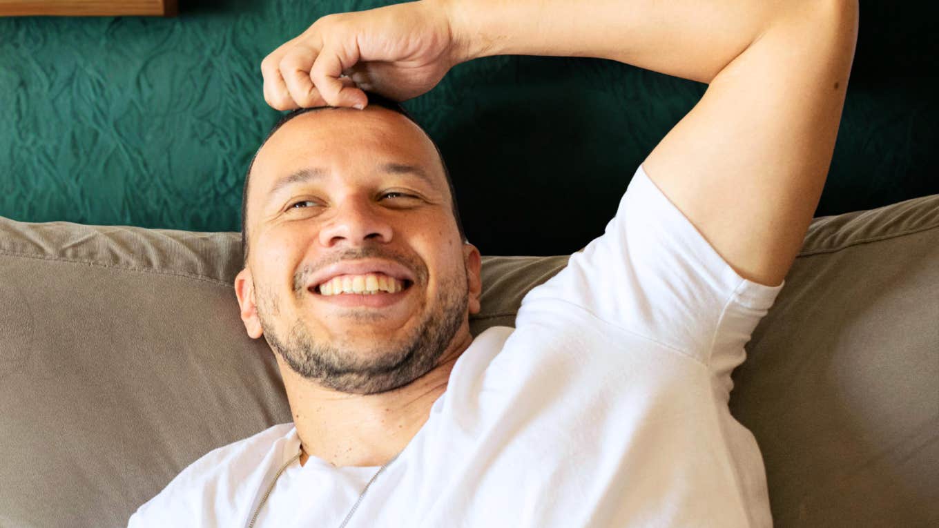Confident smiling guy showing the tricks guys who never get stuck in the friend zone