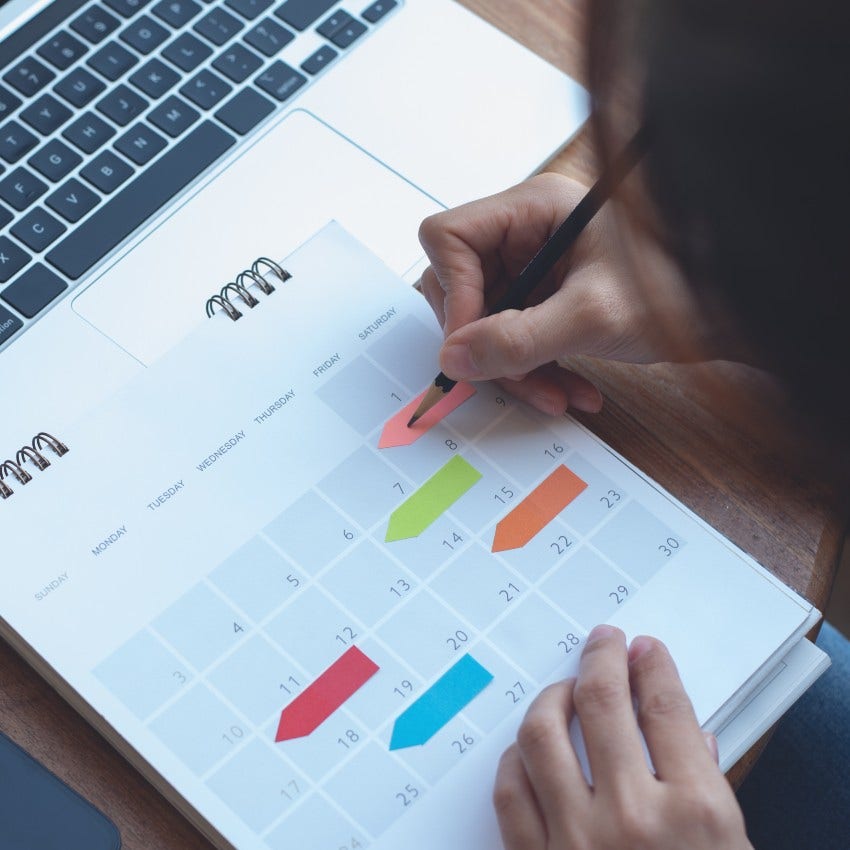 person who has been let down too many times as they add reminders to calendar