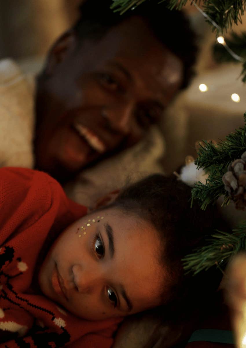 happy adult behind unhappy child